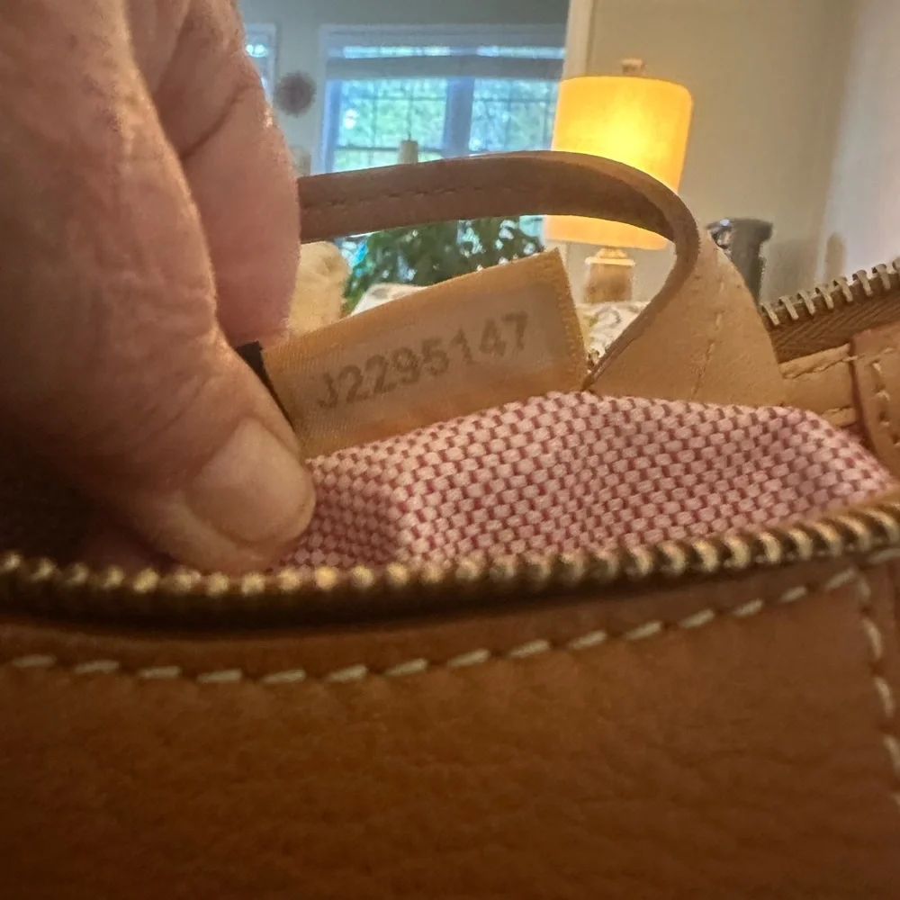 Dooney & Bourke Pebbled Grain Pocket Sac Crossbody with Side Pockets.